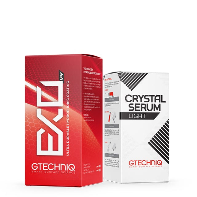 Two boxes of GTechniq vehicle serums, one red and one white, with the brand name visible on the packaging.